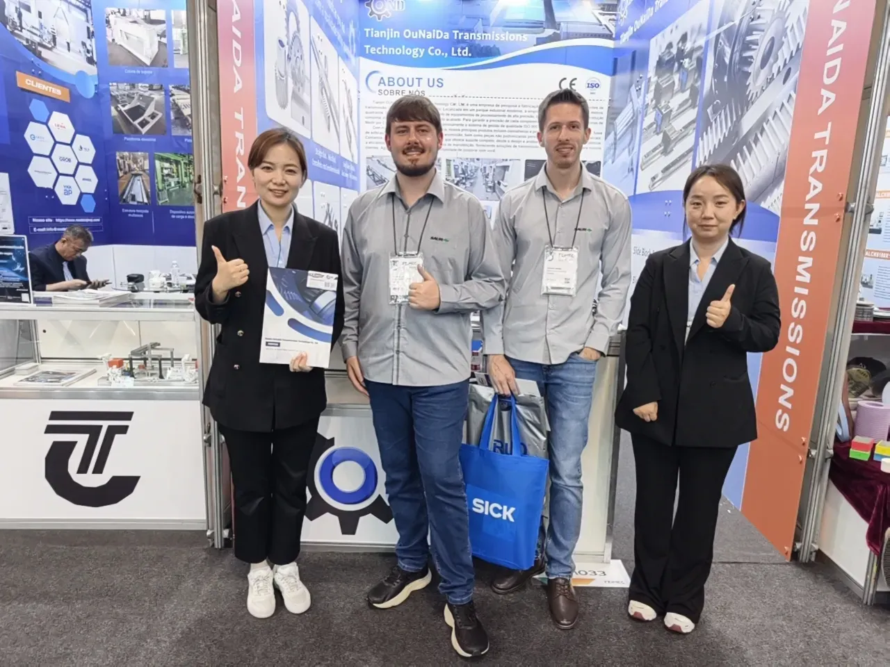 TJOND team with customers at the booth during an industrial exhibition
