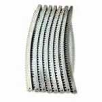 Set of galvanized curved gear rack segments on white background for greenhouse vent systems