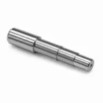 CNC turned stepped steel shaft with ground journals and centre hole
