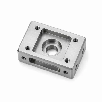 CNC milled steel block component with pocket, counterbored hole and tapped holes
