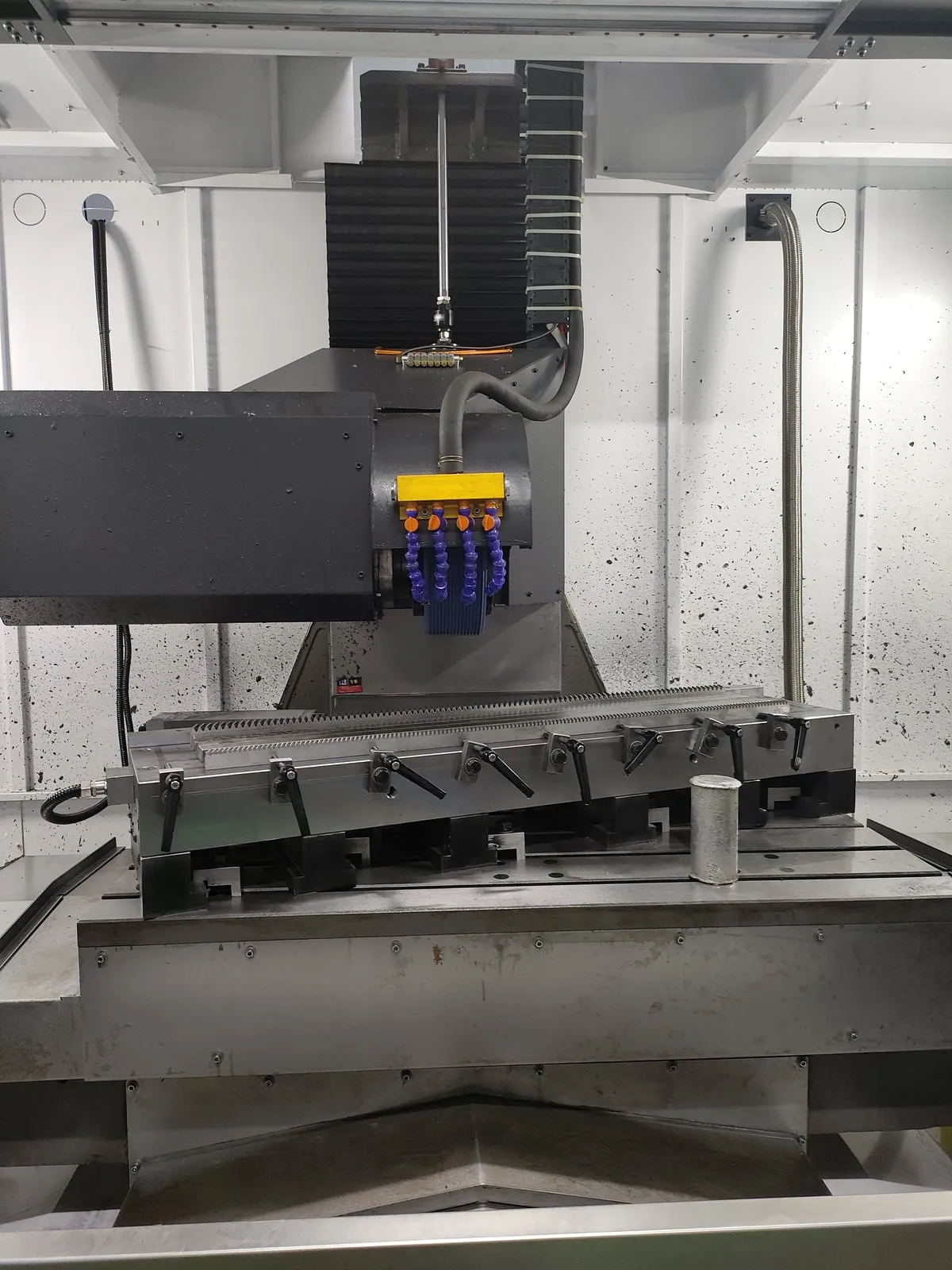 CNC gear rack grinding machine with a row of racks clamped for grinding