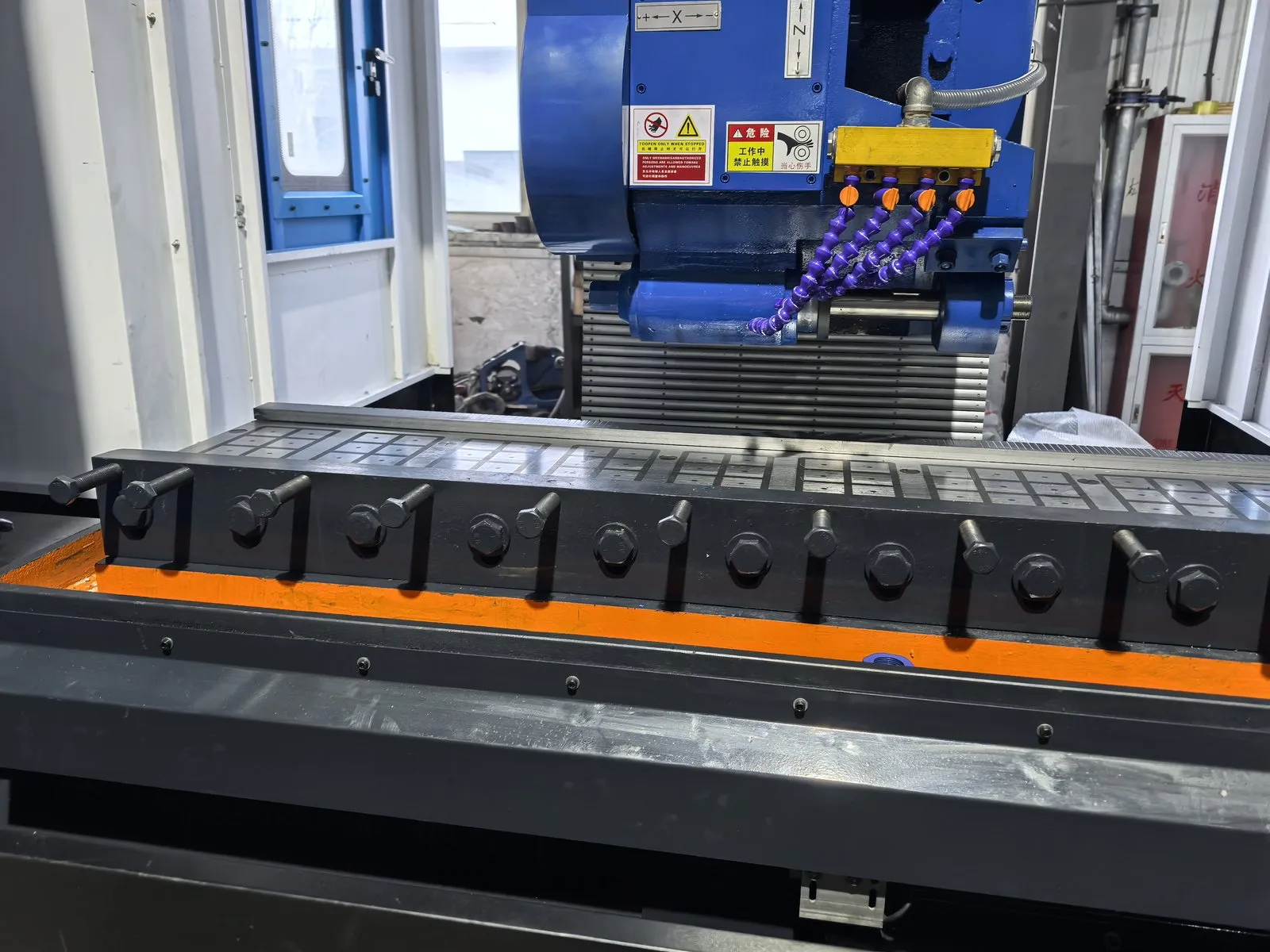 Gear rack blank clamped on a CNC rack milling machine table